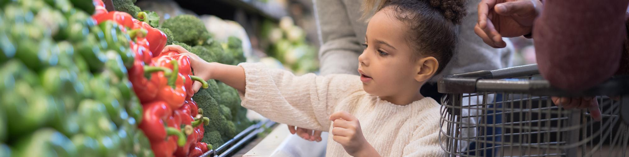 child picking out healthy food